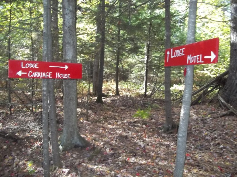 Trail signs for the 1/4 mile trail at Wiscasset Woods Lodge in Midcoast Maine.