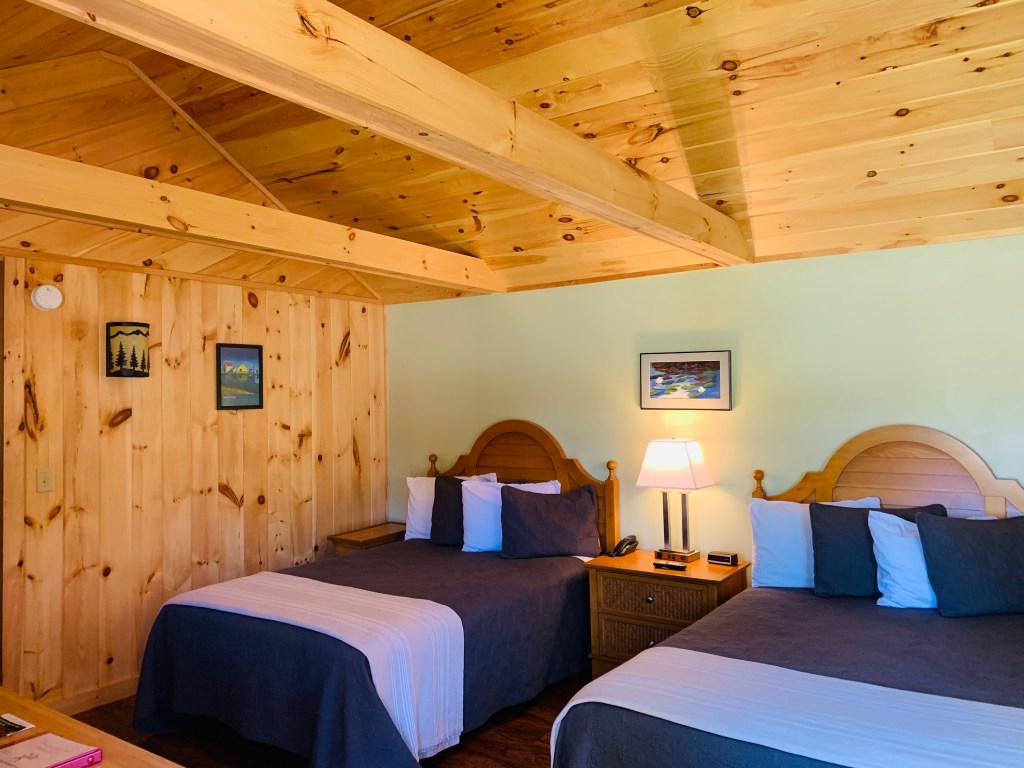 Two full beds in our handicap accessible hotel room at Wiscasset Woods Lodgein Midcoast Maine.
