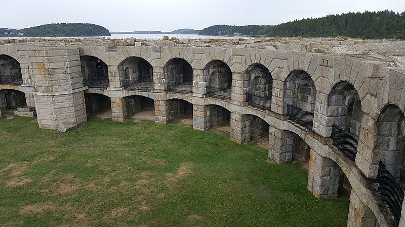 The crescent shape of Fort Popham with a glimpse of the ocean in the background.